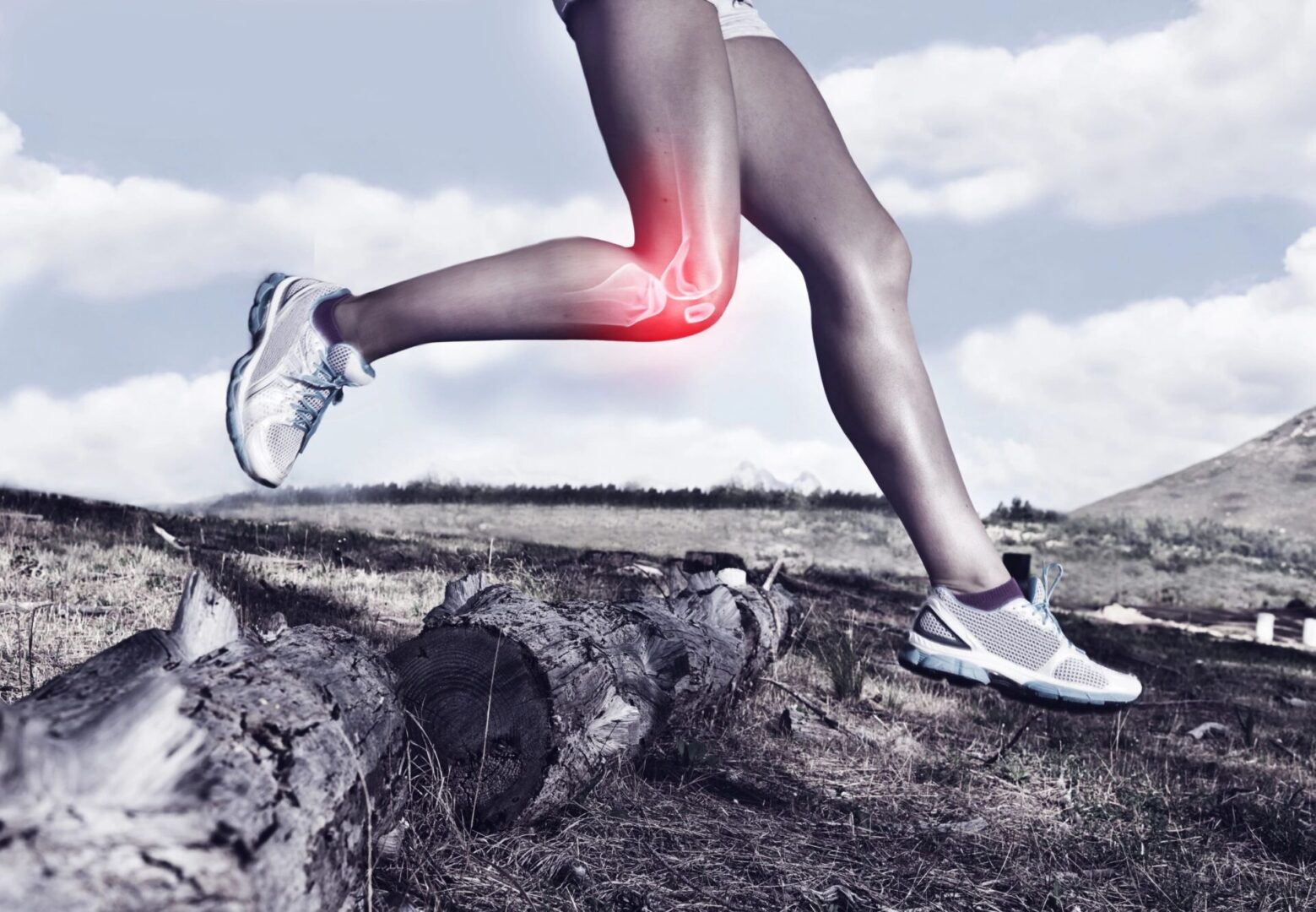 Woman jumping over log with knee pain.